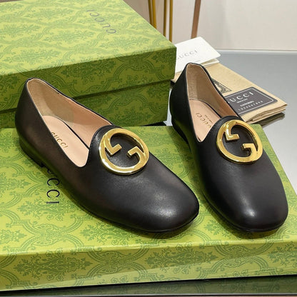 BLONDIE LOGO-PLAQUE LOAFERS IN BLACK CALFSKIN