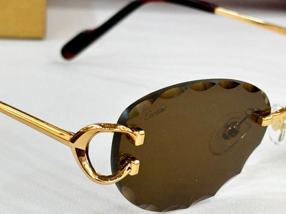 C DE RIMLESS ROUND FRAME SUNGLASSES CT0599S IN METAL