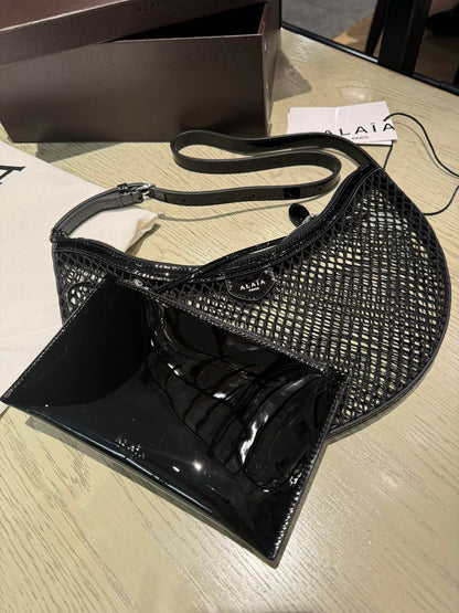 ALAIA ONE PIECE half-moon bag black patent leather 243053