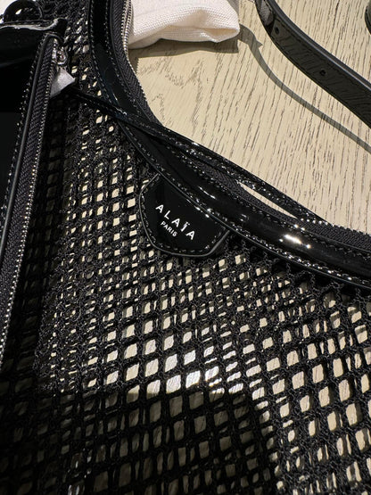 ALAIA ONE PIECE half-moon bag black patent leather 243053