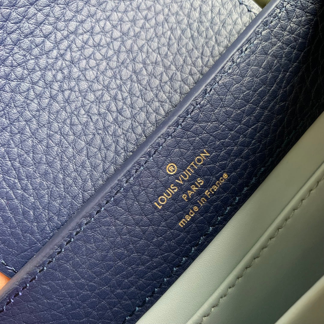 CAPUCINES MINI 21 DARK BLUE TAURILLON GOLD HARDWARE