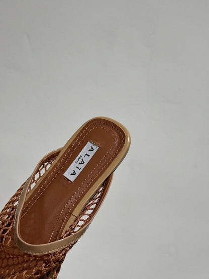 ALAIA FLAT MULES IN COPPER BROWN MESH FISHNET