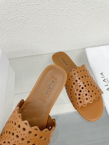 ALAIA VIENNE FLAT MULES IN CHOCOLATE BROWN LAMBSKIN