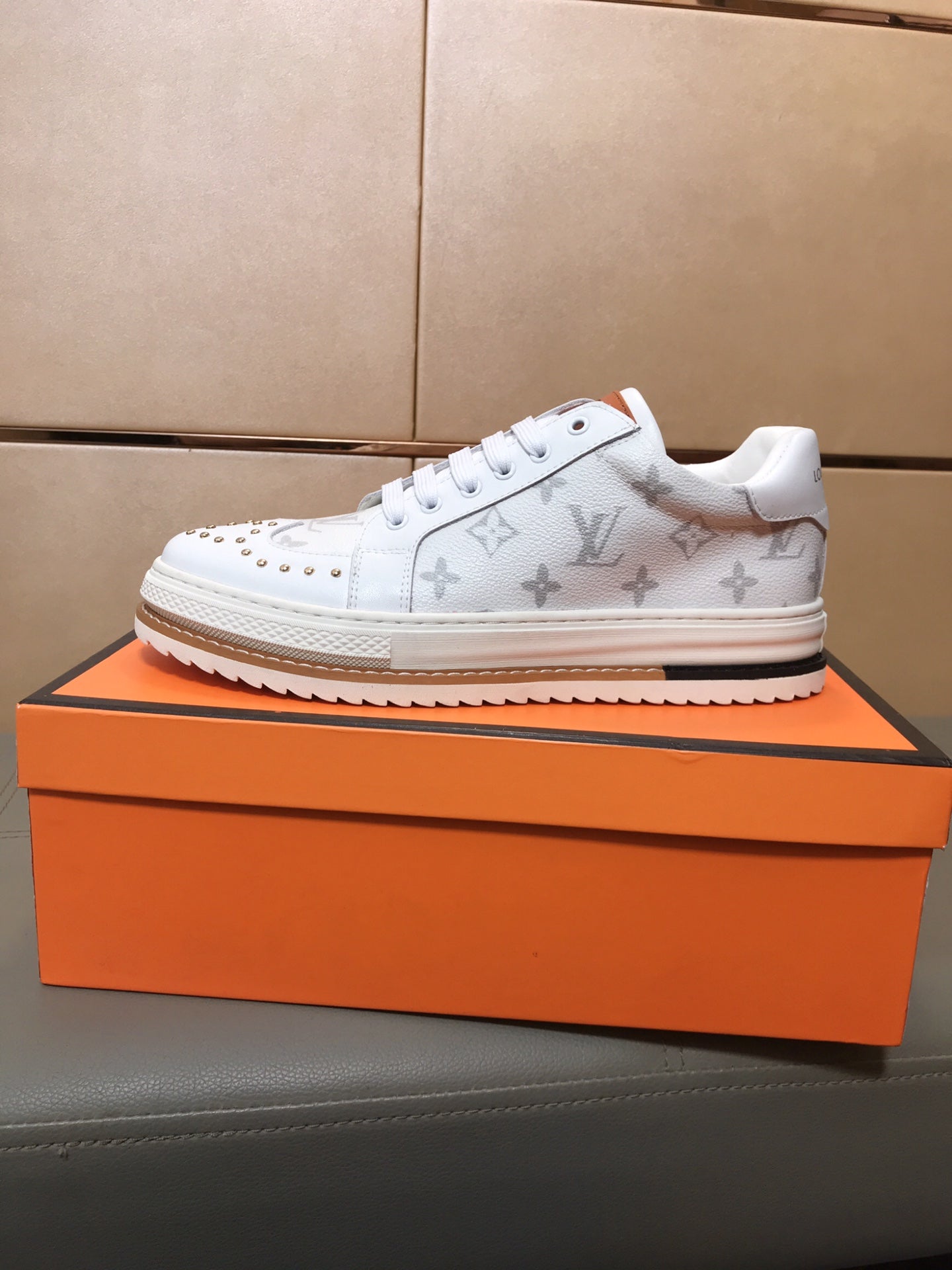 LV TRAINER IN WHITE MONOGRAM CALFSKIN